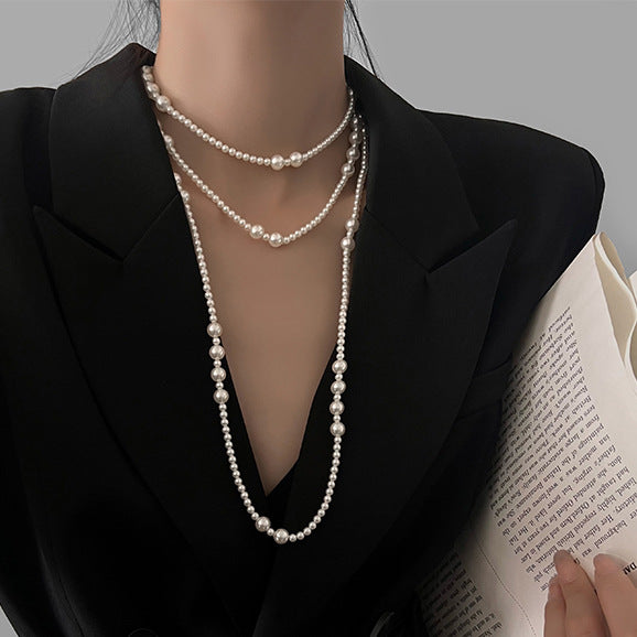 Long multi-layer pearl necklace