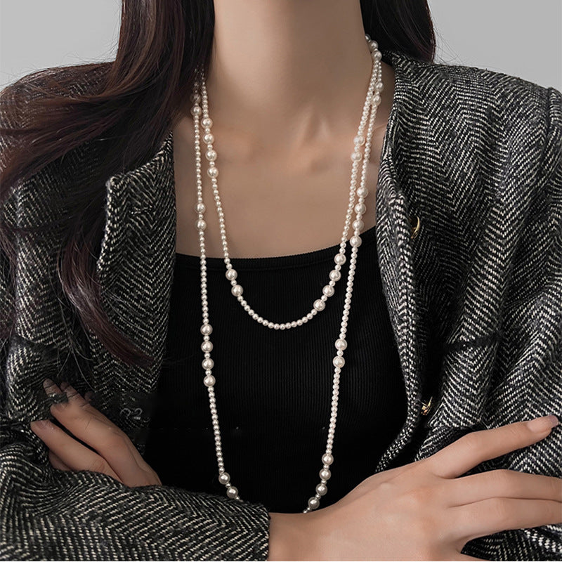 Long multi-layer pearl necklace