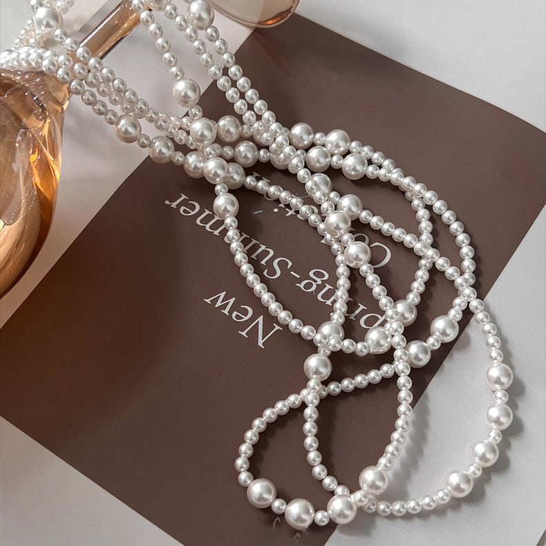 Long multi-layer pearl necklace