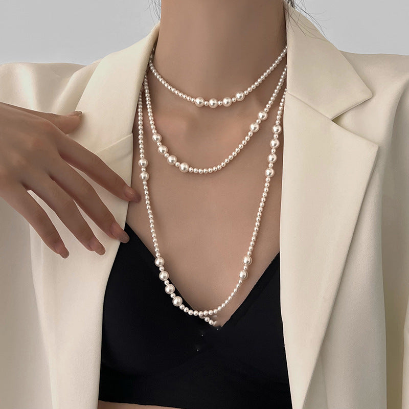 Long multi-layer pearl necklace