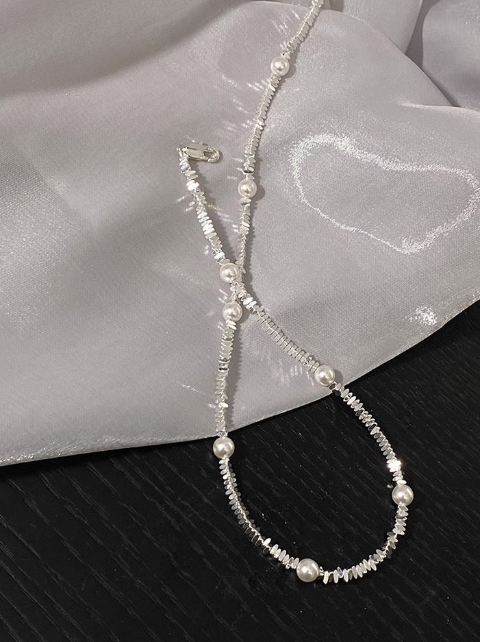 Pearl broken silver gypsy star design necklace