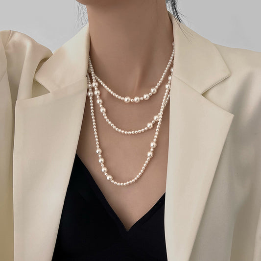 Long multi-layer pearl necklace